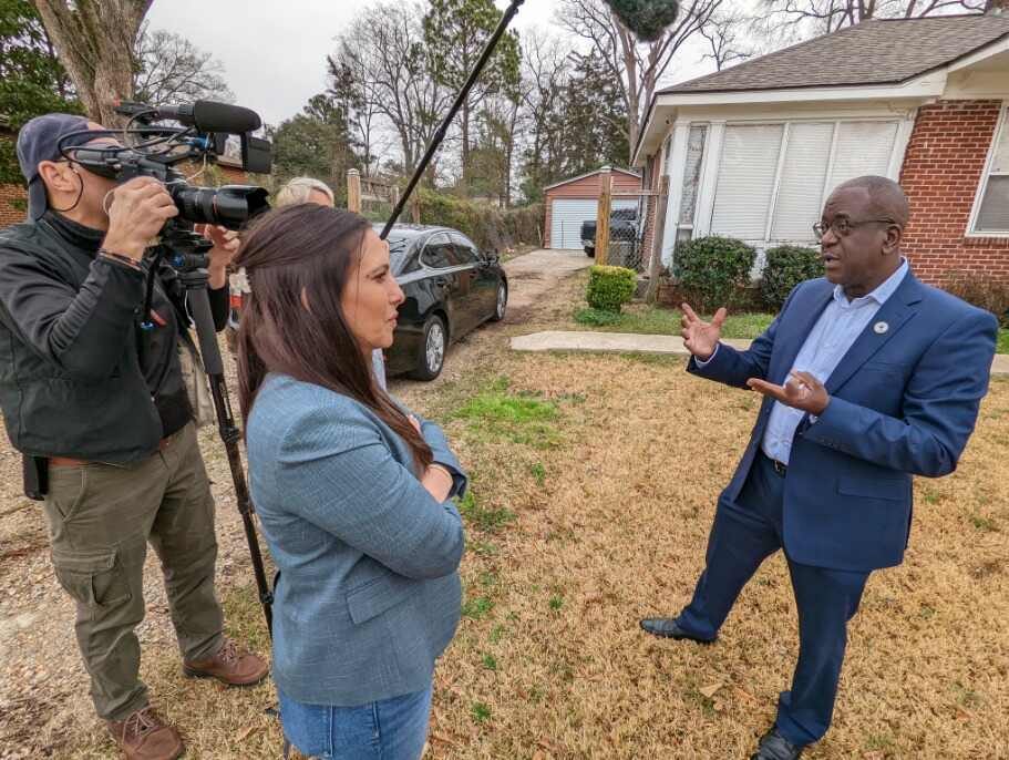 Jessica Jallings Gomez interviewing a subject on location