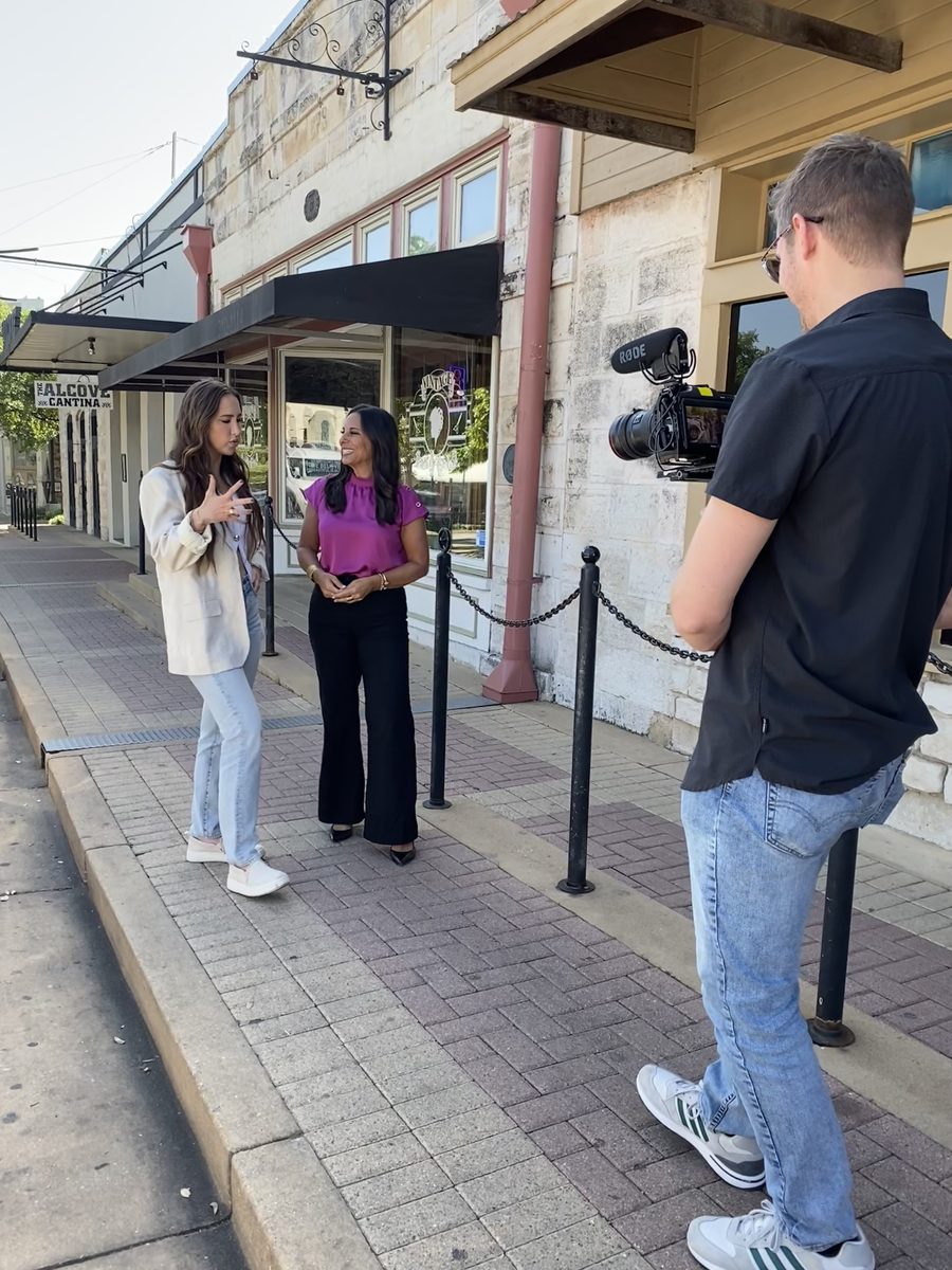Jessica Jallings Gomez interviewing someone on location